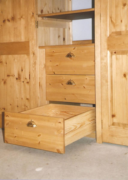 Pine wardrobe showing internal drawers