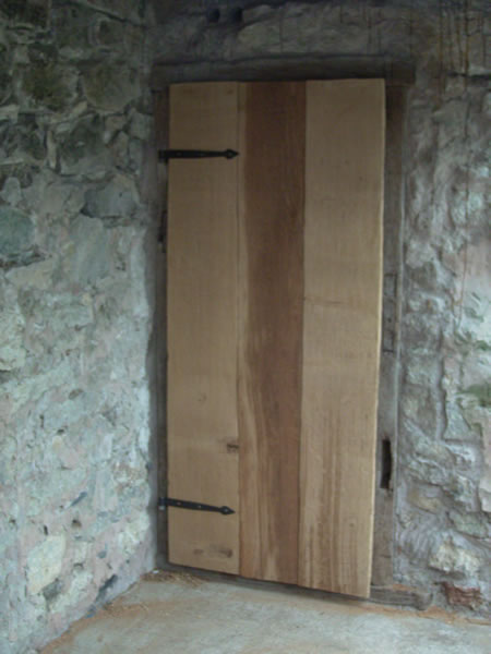 Ledge and braced door with forged hinges
