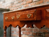yew-dresser-base-with-shaped-bottom-rail-showing-hand-cut-dovetails-on-drawers