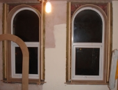 Arched windows with arched liners and architrave