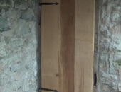 Ledge and braced door with forged hinges