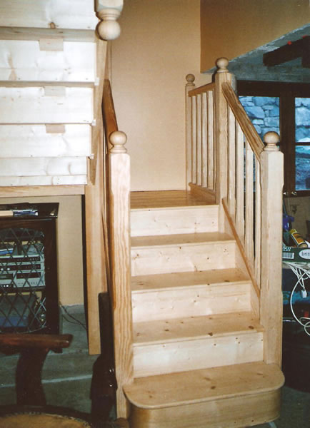 Completed lower section of yellow pine staircase